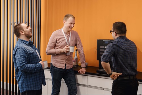A group of men chatting at a networking event